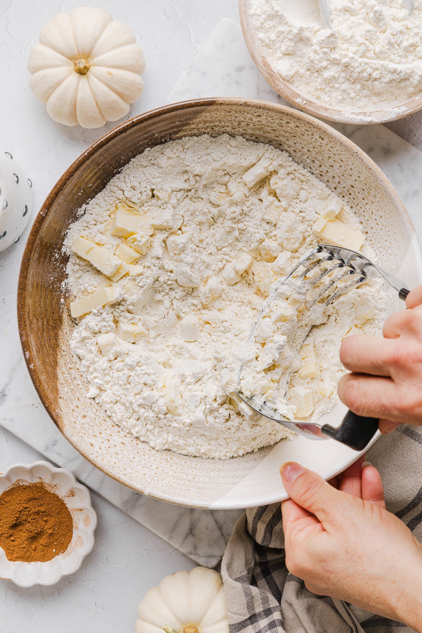 Whole wheat pie crust being rolled out for healthy pumpkin pie.