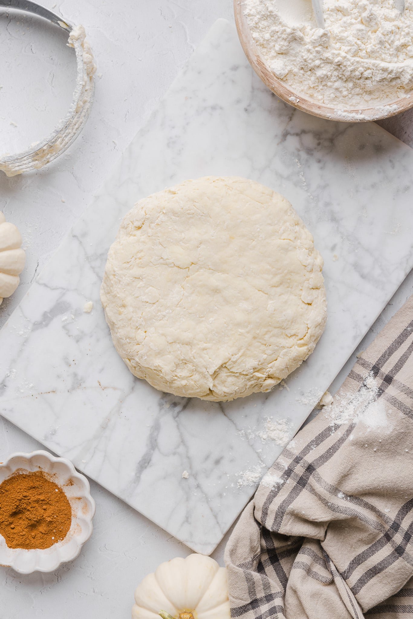 Healthy pumpkin pie crust formed into a dough disc.