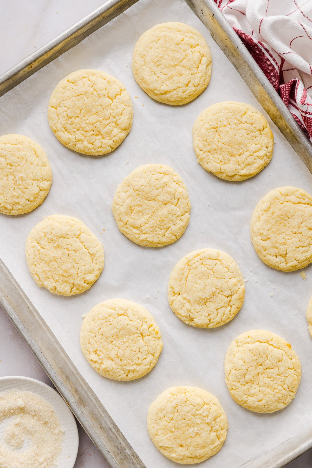 Baked whole wheat sugar cookies on a baking sheet.