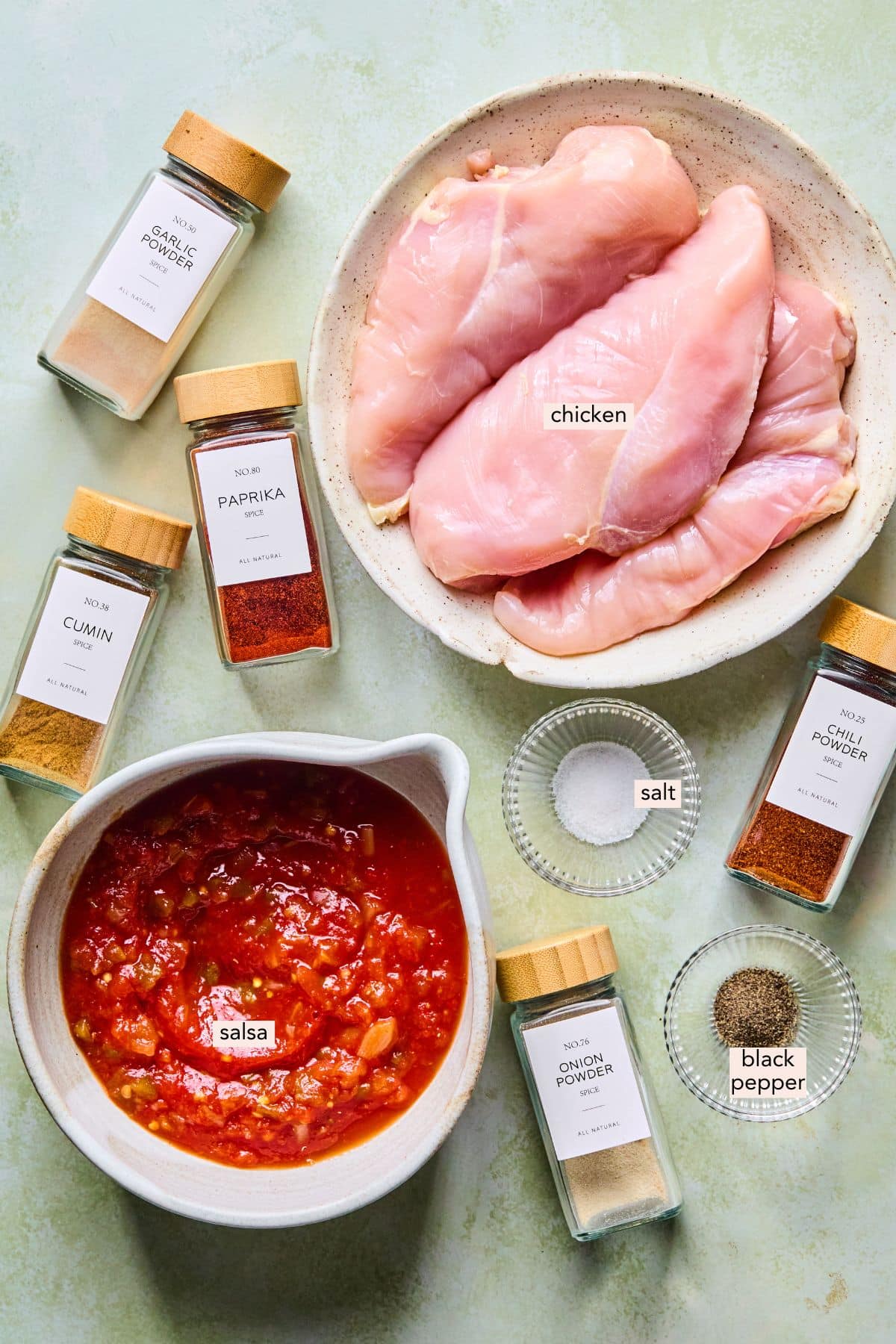 Slow cooker shredded chicken taco ingredients out on a countertop.