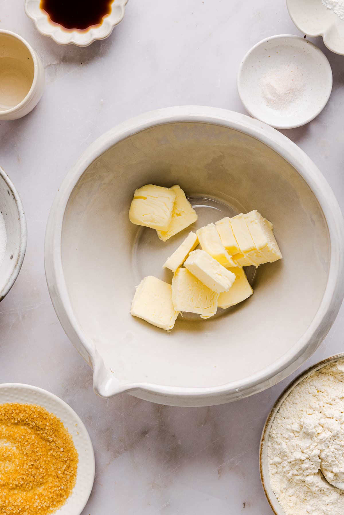 Sliced butter in a bowl for whole wheat sugar cookies.