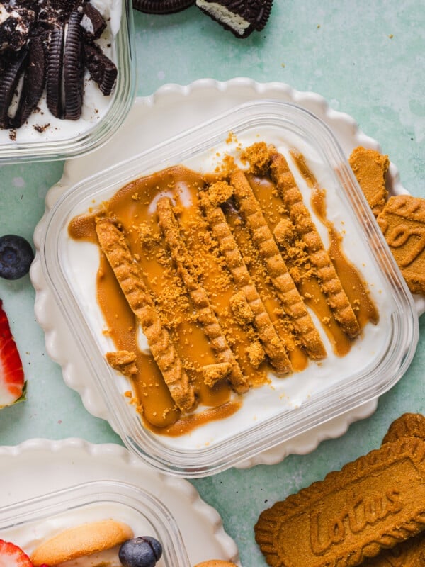 Biscoff cookies and cookie butter in Greek yogurt in a container.