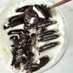 2 ingredient yogurt cheesecake being scooped out with a spoon.