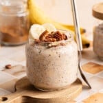 Banana bread overnight oats in a jar with a spoon.