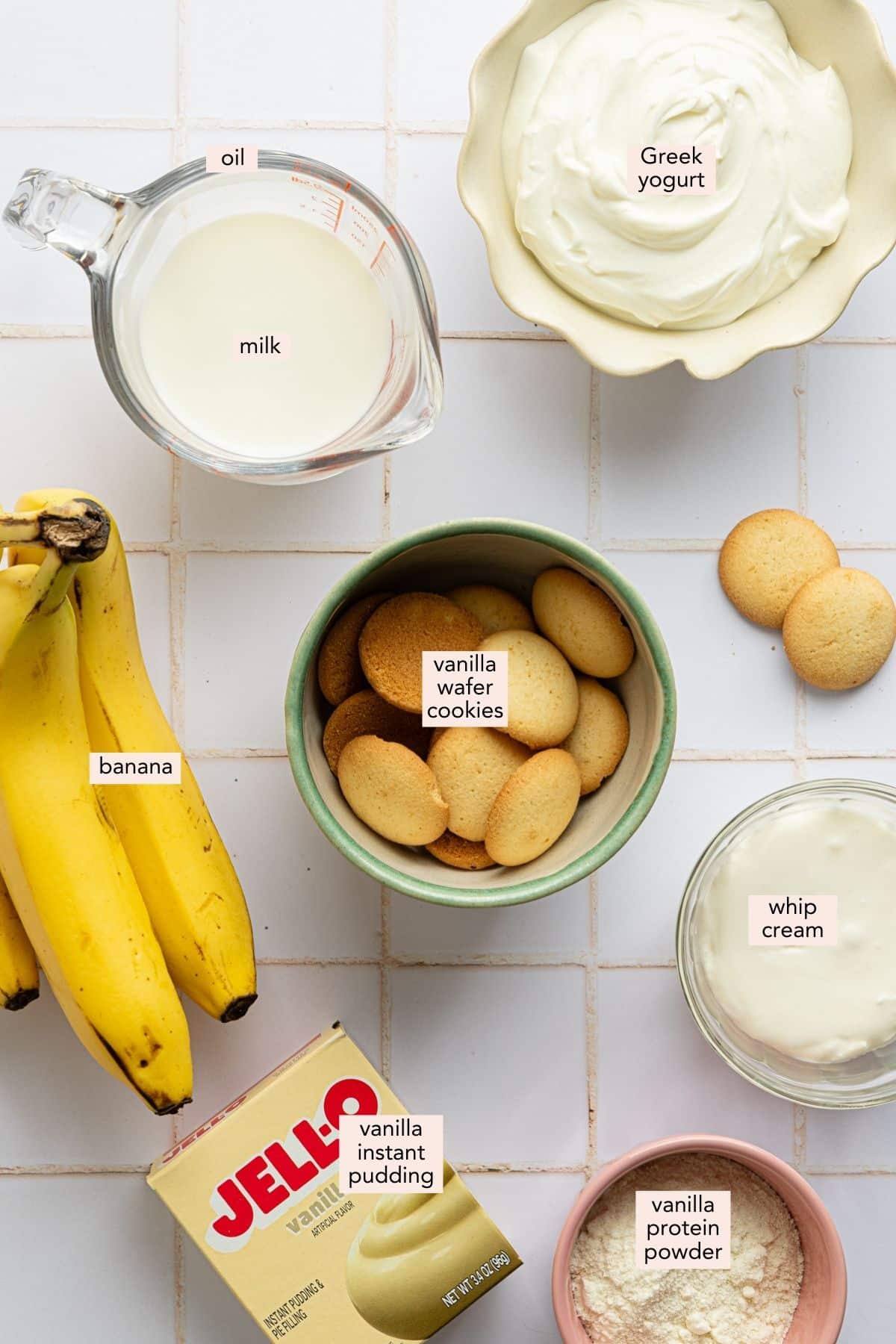 Ingredients for high protein banana pudding on a countertop with labels.