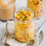 Just Crack an Egg copycat in a mason jar in front of a cup of coffee.