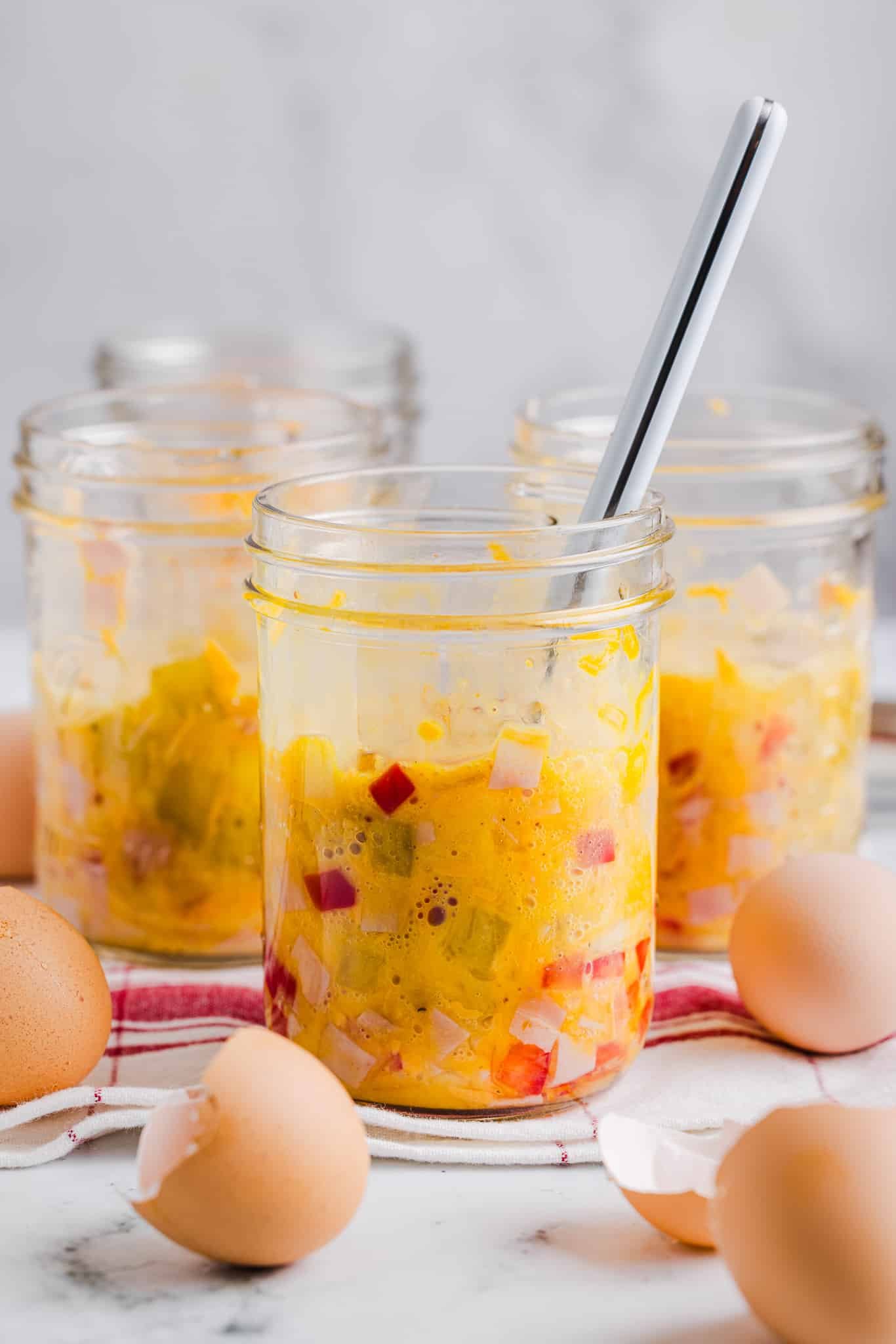 Egg mixed into toppings in a mason jar for Just Crack An Egg (copycat).