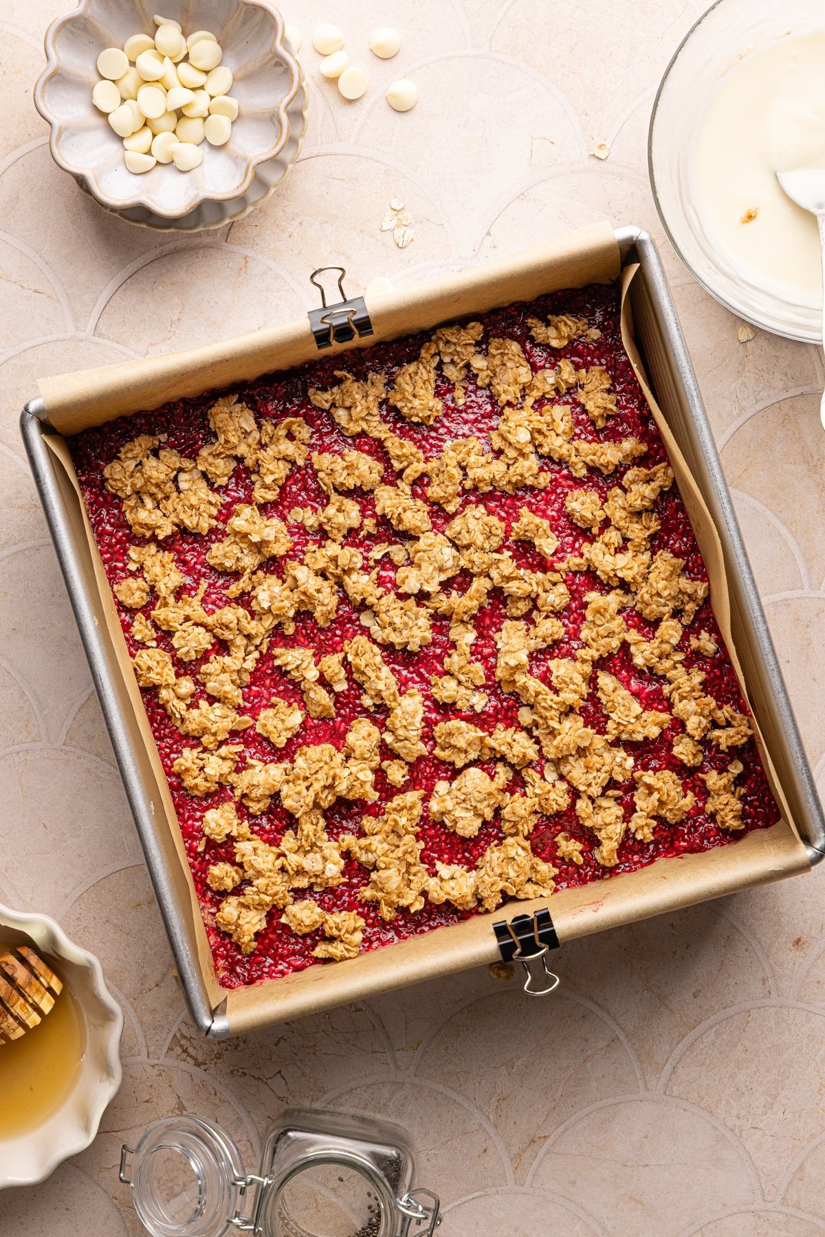Assembled no bake PB and J oat bars in a square pan.