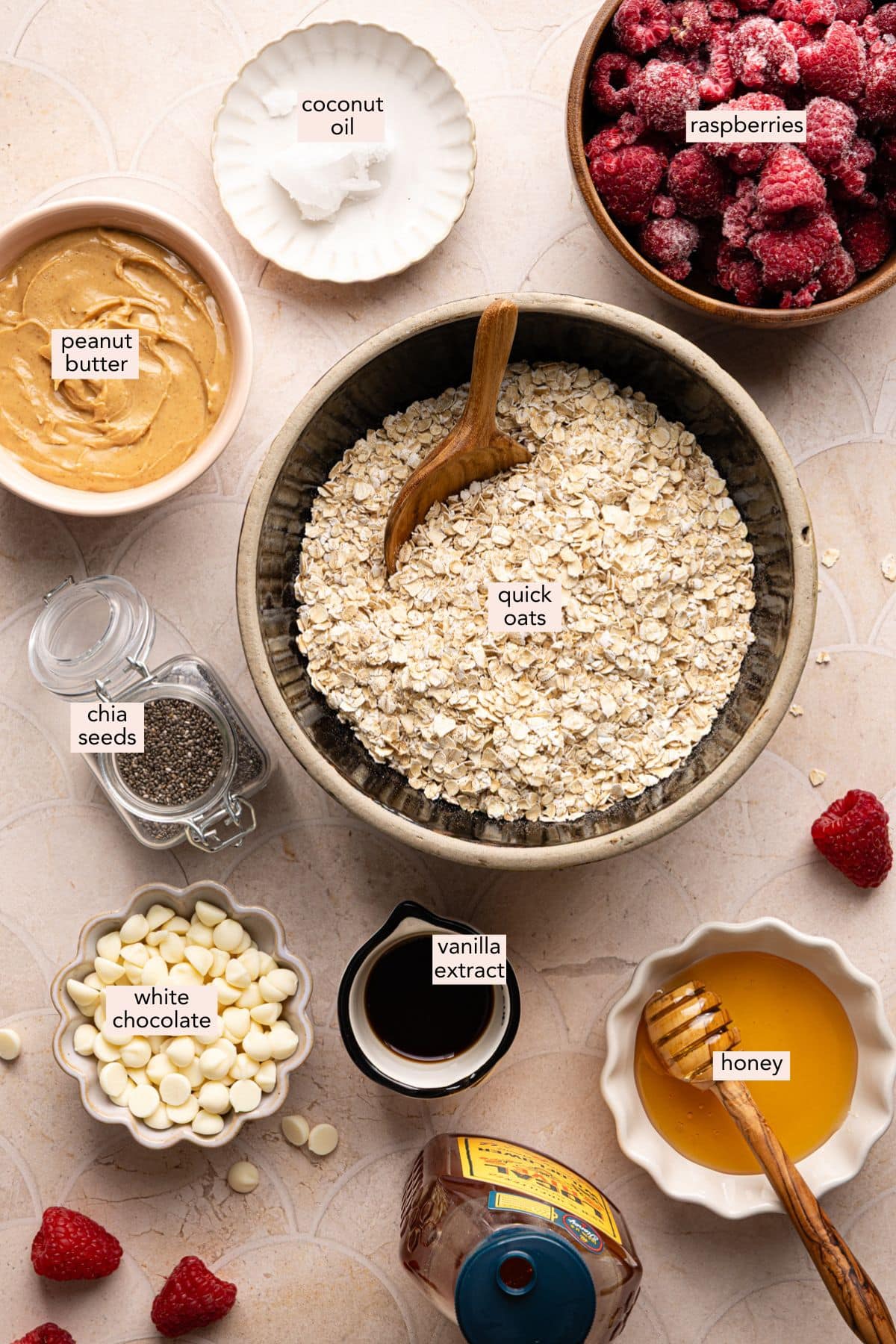 Ingredients for PB and J oat bars on a countertop with labels.
