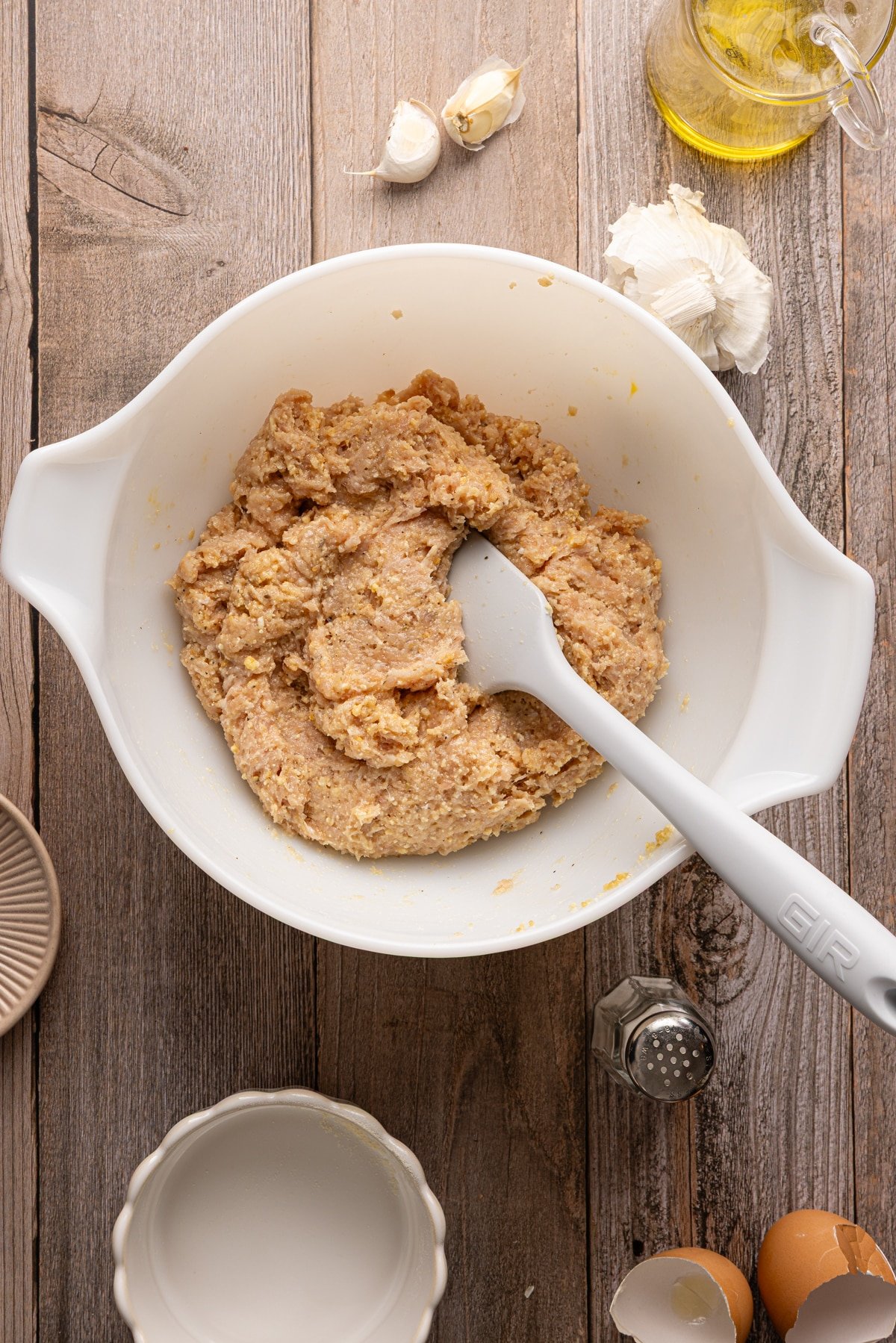 Chicken meatball mixture mixed in a bowl.