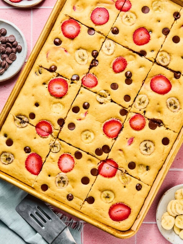 The baked sheet pan pancakes in the sheet pan cut into 12 slices.