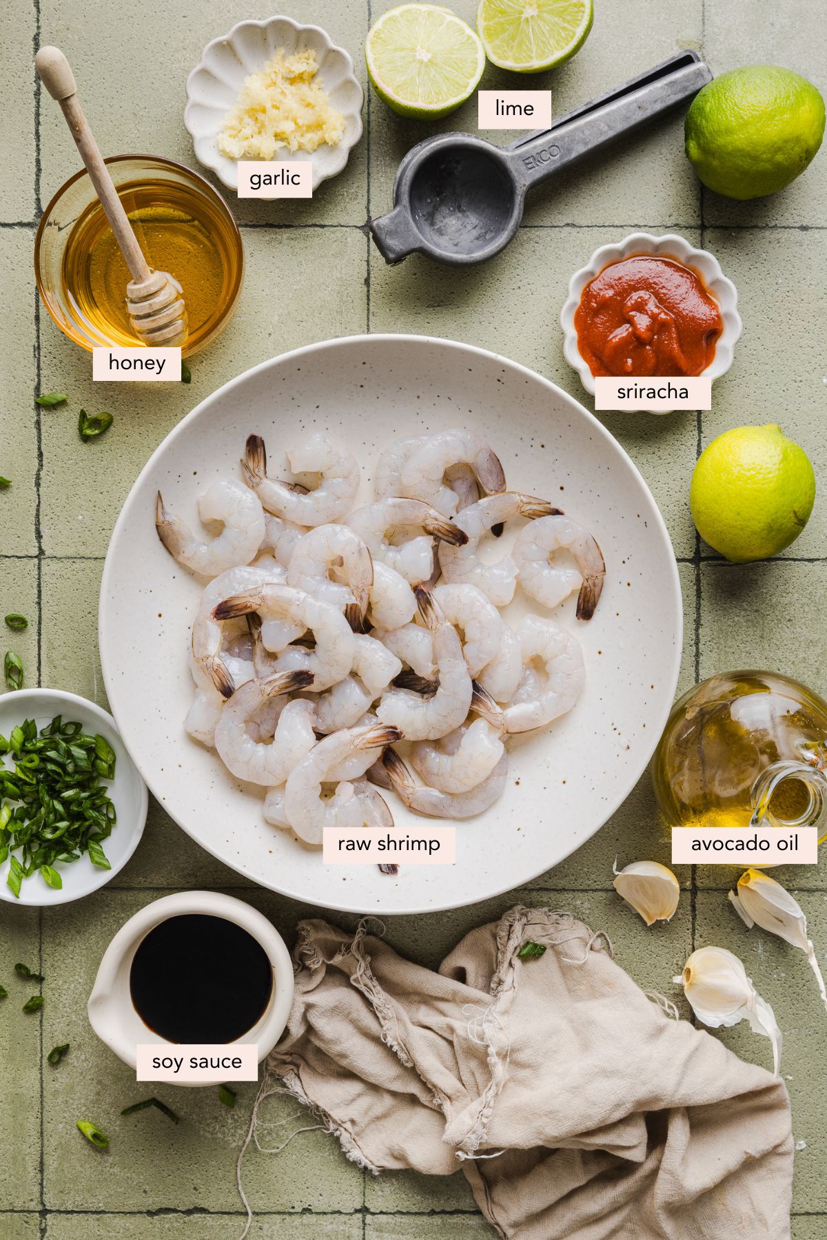 All of the ingredients for honey sriracha shrimp in bowls on a countertop.