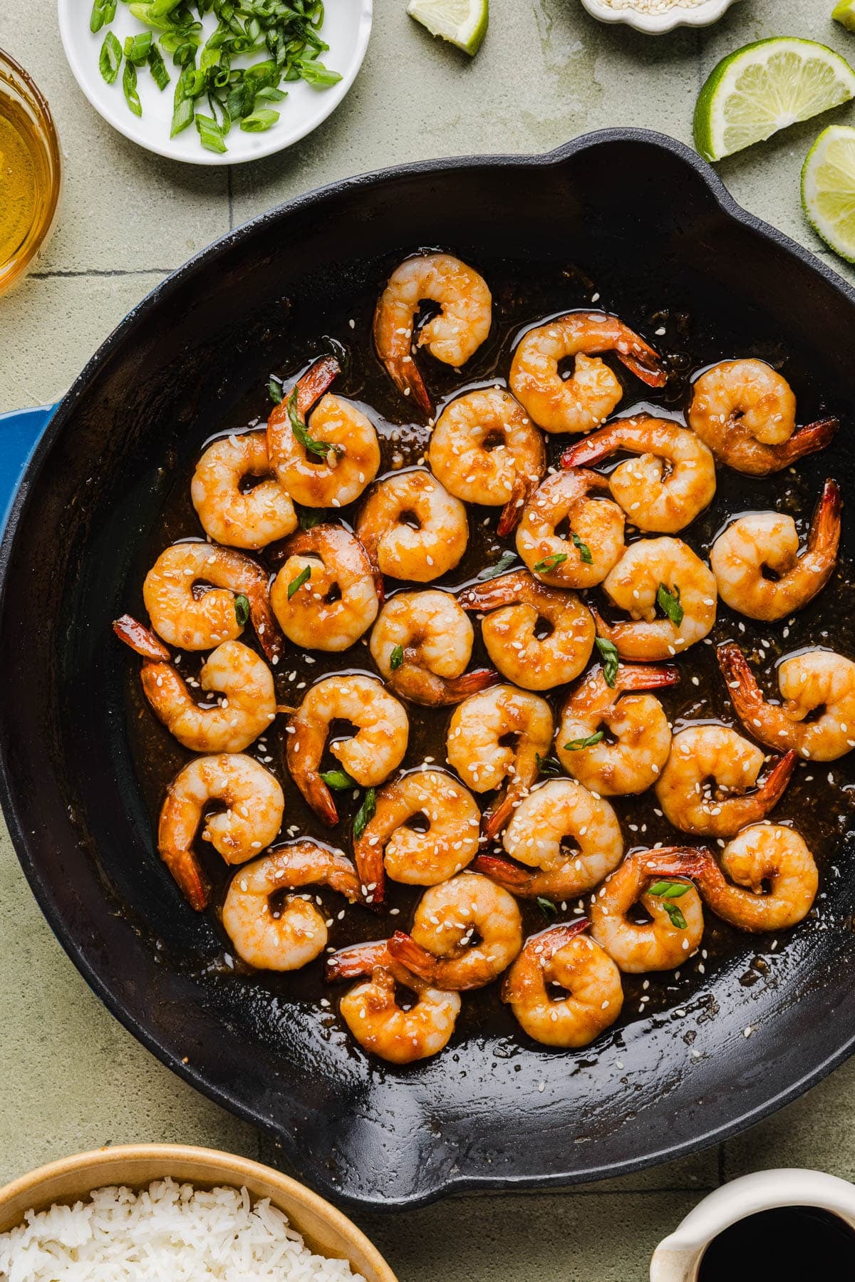 Honey sriracha shrimp in a cast iron skillet after cooking.