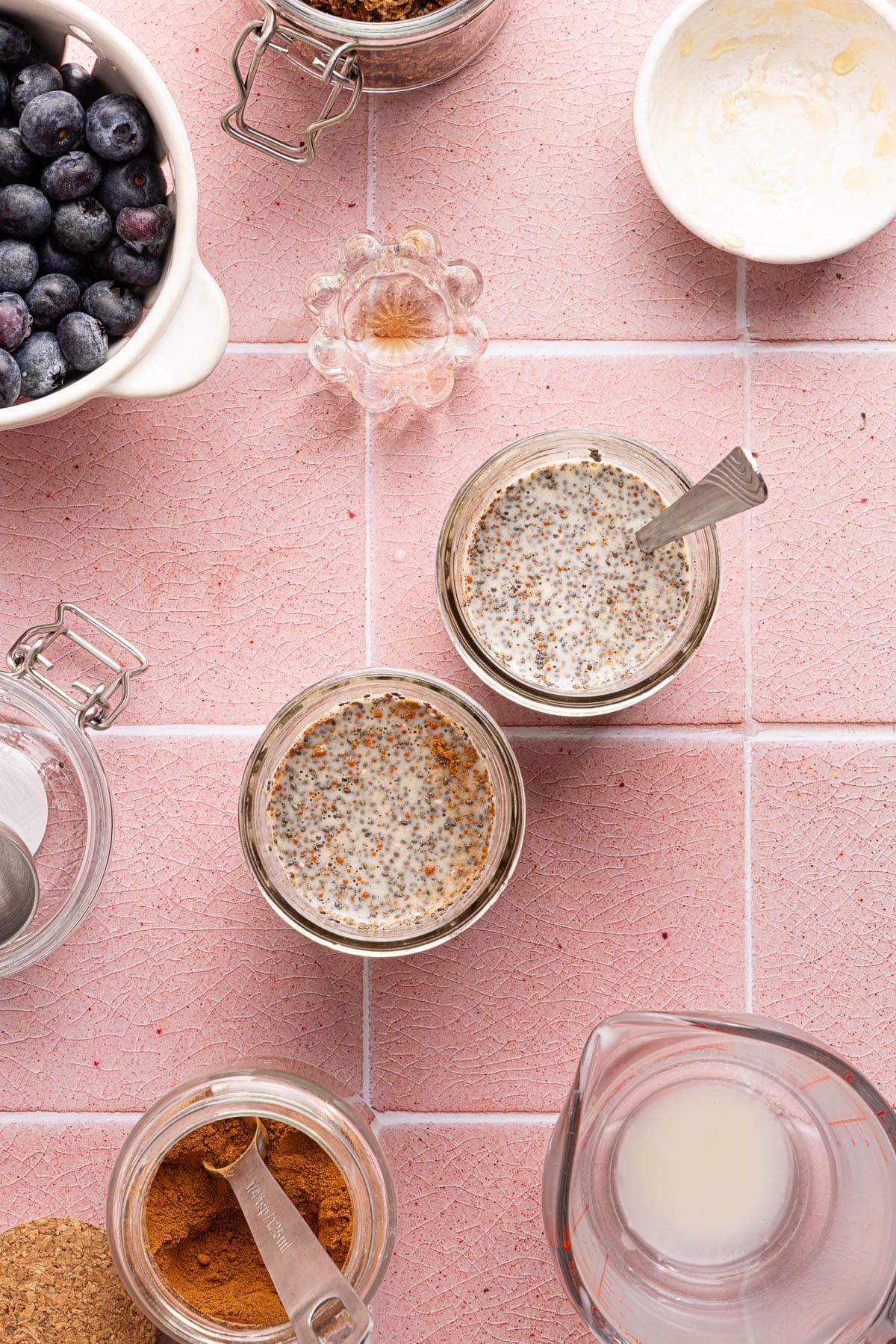 Two jars with the chia seed pudding mixture before it sits.