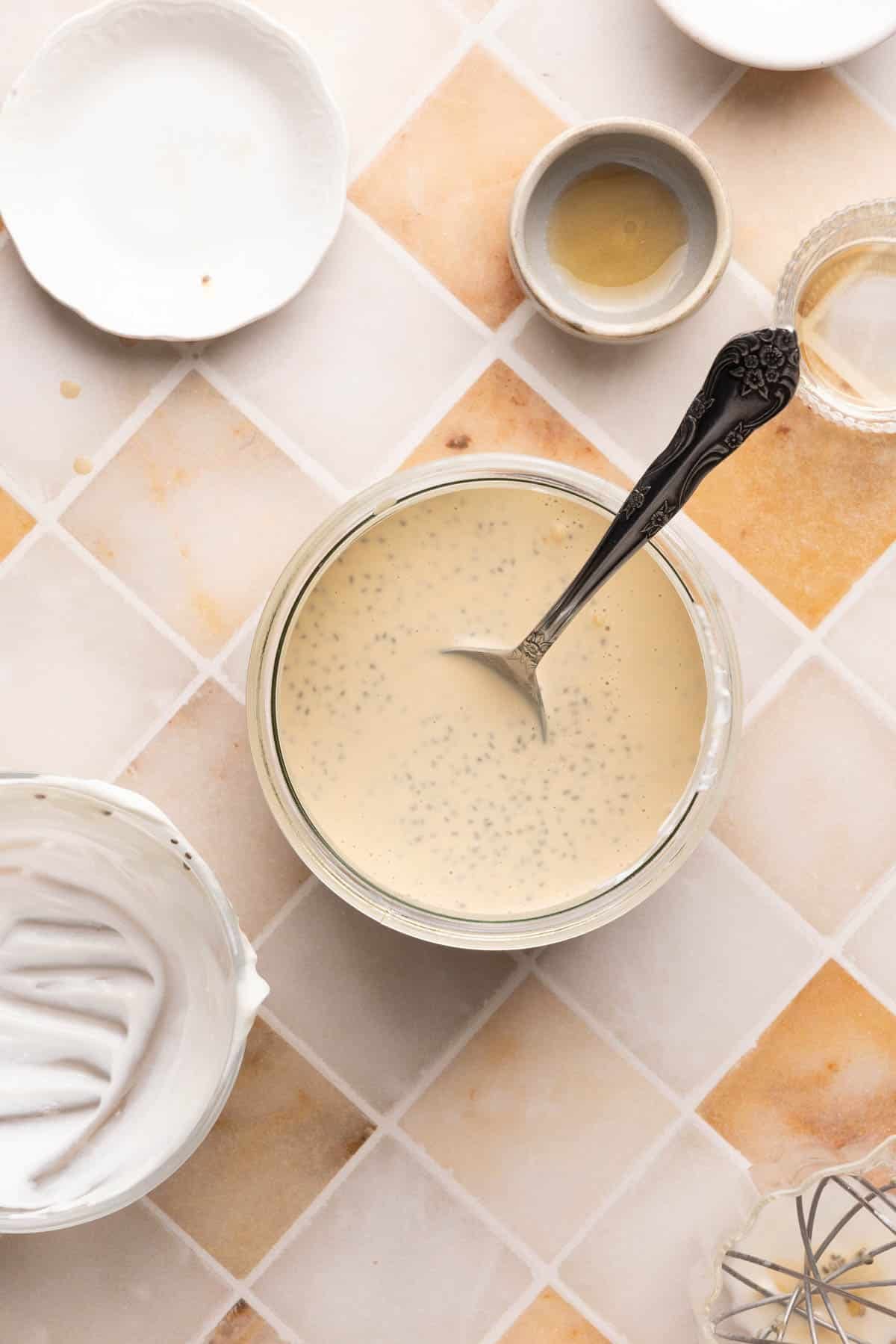 All of the ingredients for the chia pudding stirred together in the glass jar before chilling.