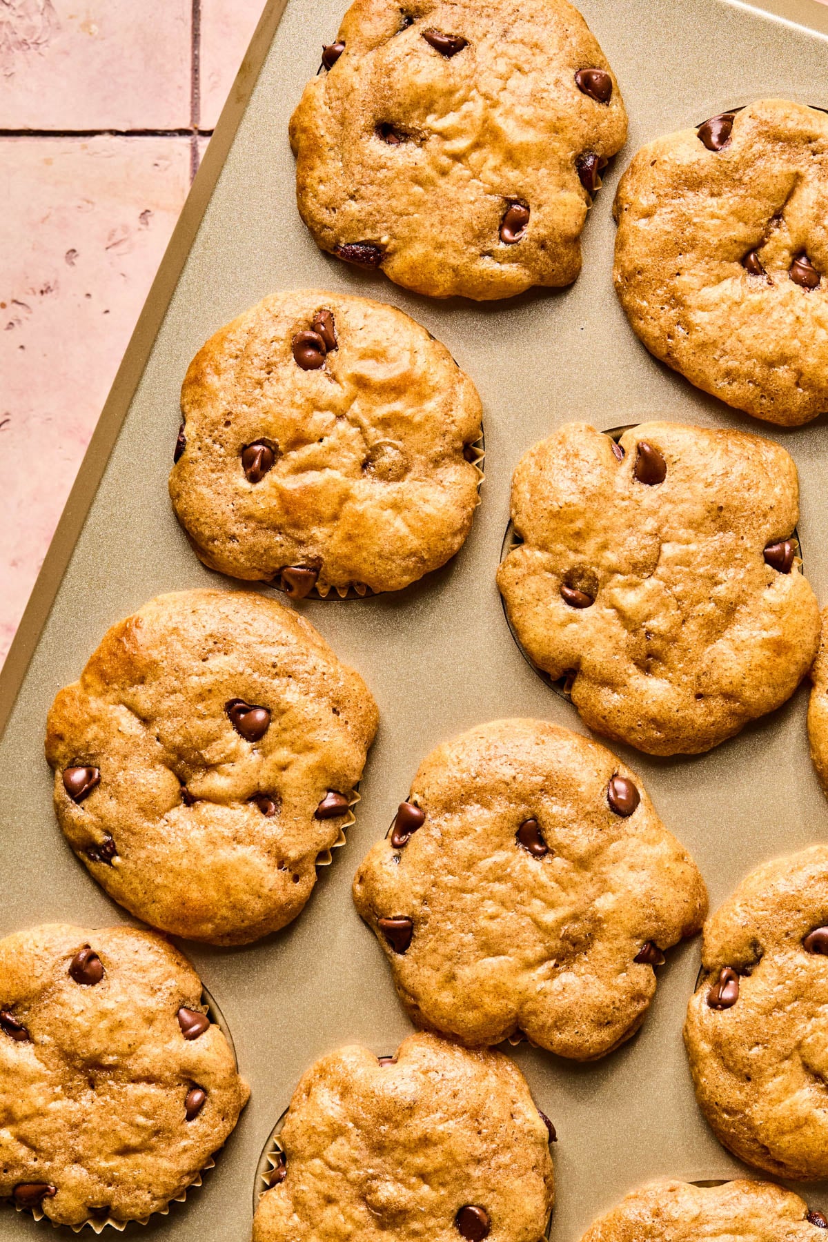 The baked cottage cheese chocolate chip muffins in a baking pan after baking.