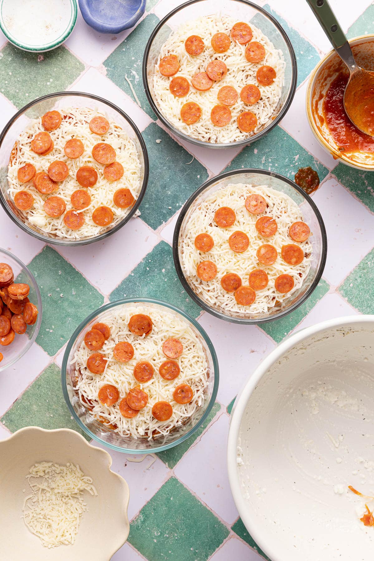The cottage cheese pizza bowls in the small bowls before placing in the oven.
