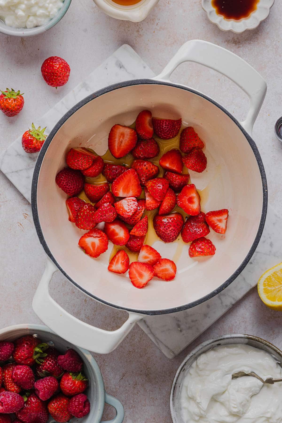 The strawberries, syrup, and lemon juice in a small sauce pan.