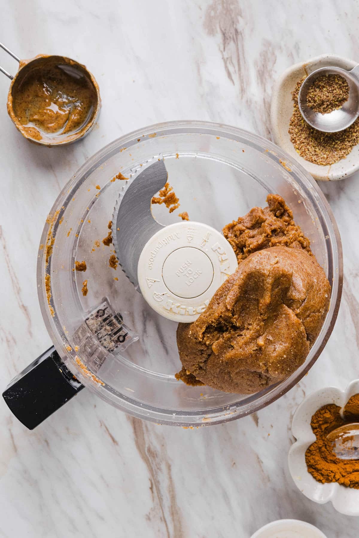 The blended mixture in the food processor bowl.