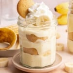 A jar filled with cottage cheese banana pudding on a countertop for serving.