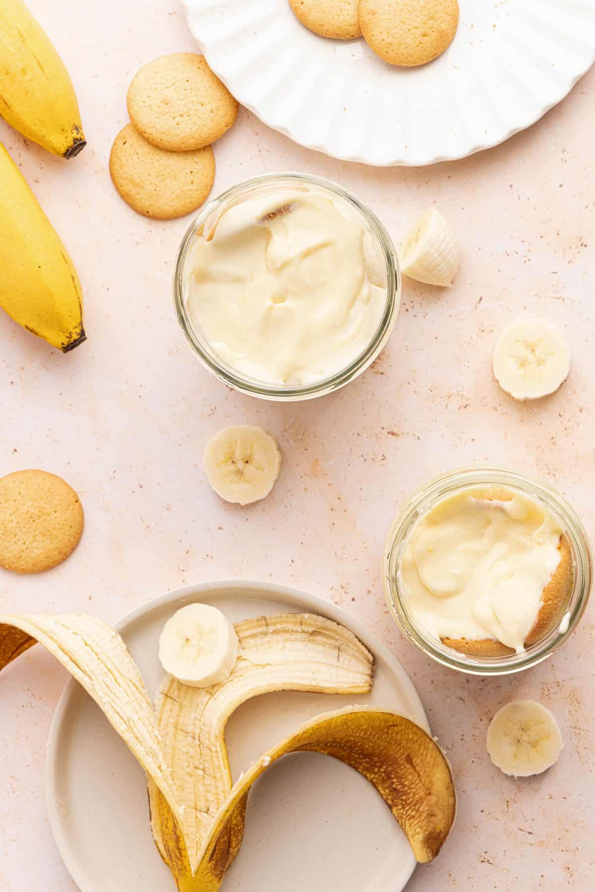 The banana pudding layered into glass jars before chilling.