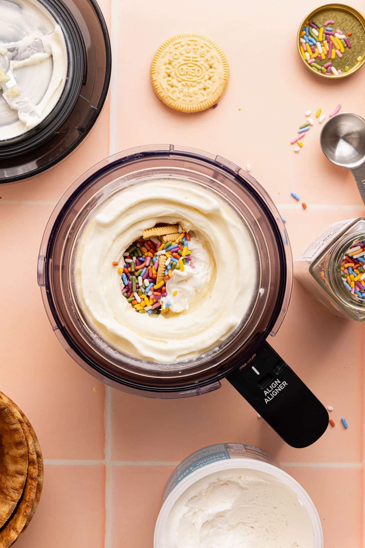 The sprinkles, frosting, and cookie in the small hole in the center of the ice cream.
