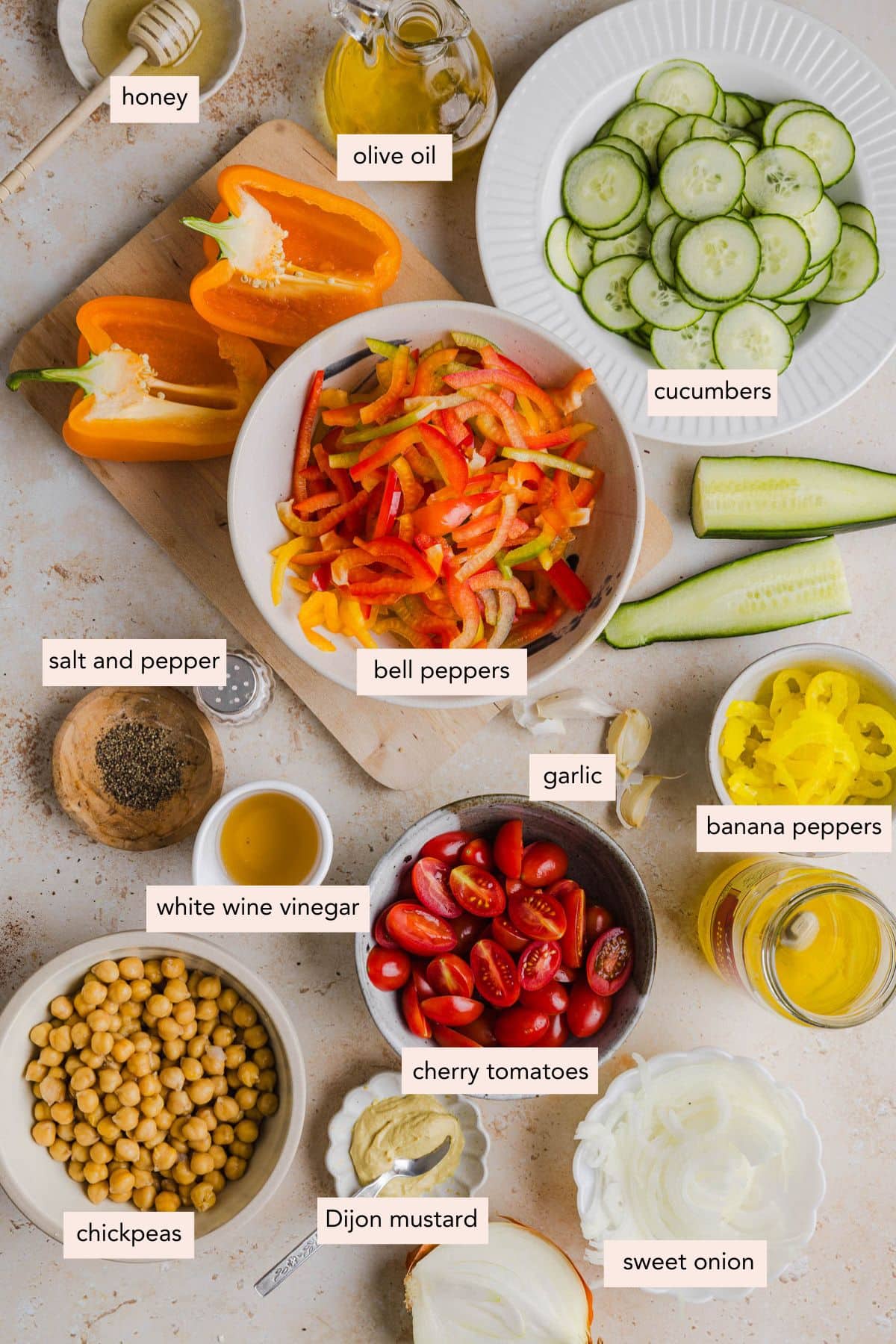 All of the ingredients for no lettuce salad in bowls on a countertop.
