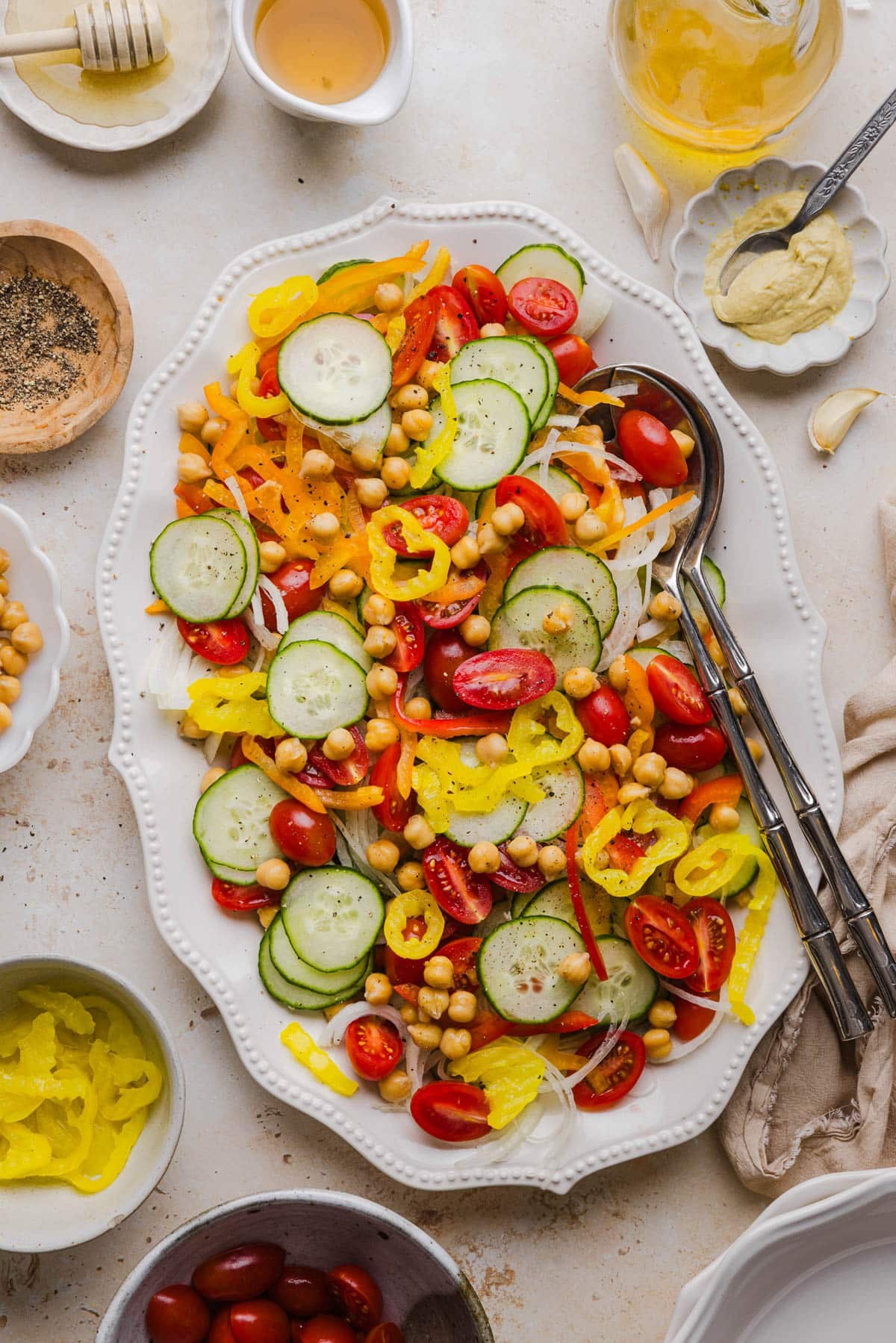 All of the ingredients for no lettuce salad on a platter before pouring on the dressing.
