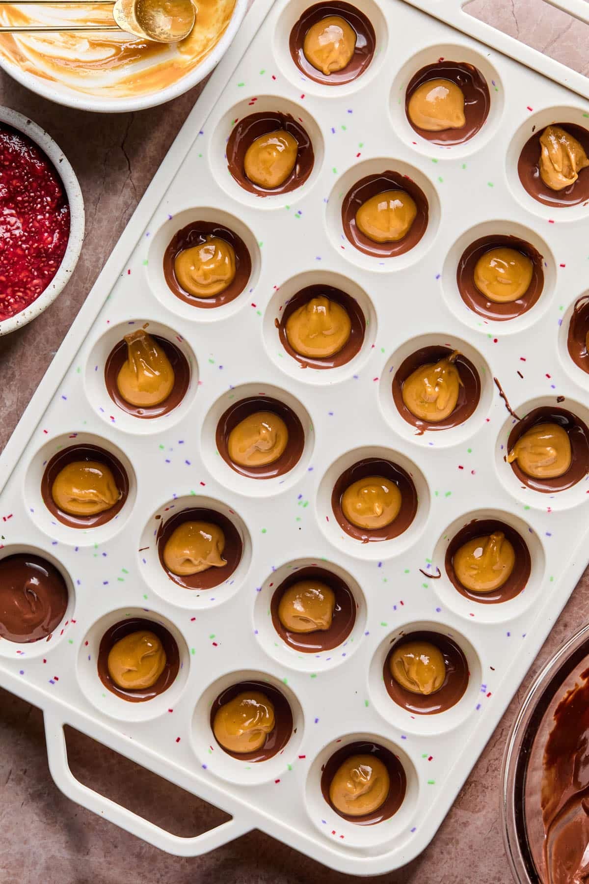 The peanut butter on top of the chocolate in the cup.