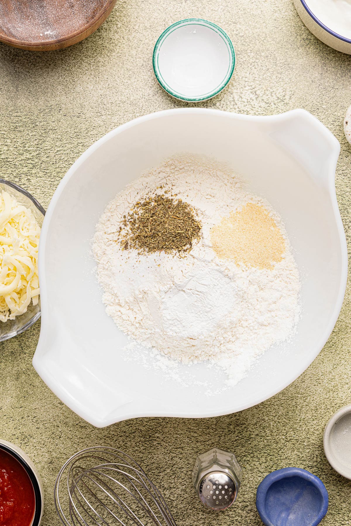 The dry ingredients in a bowl before mixing.