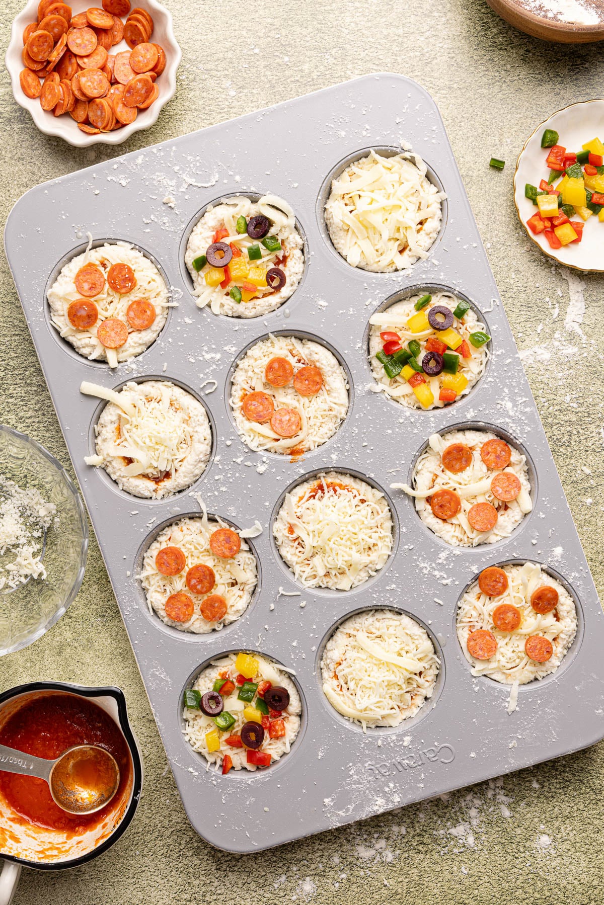 The assembled muffin cups in the muffin tin before baking.