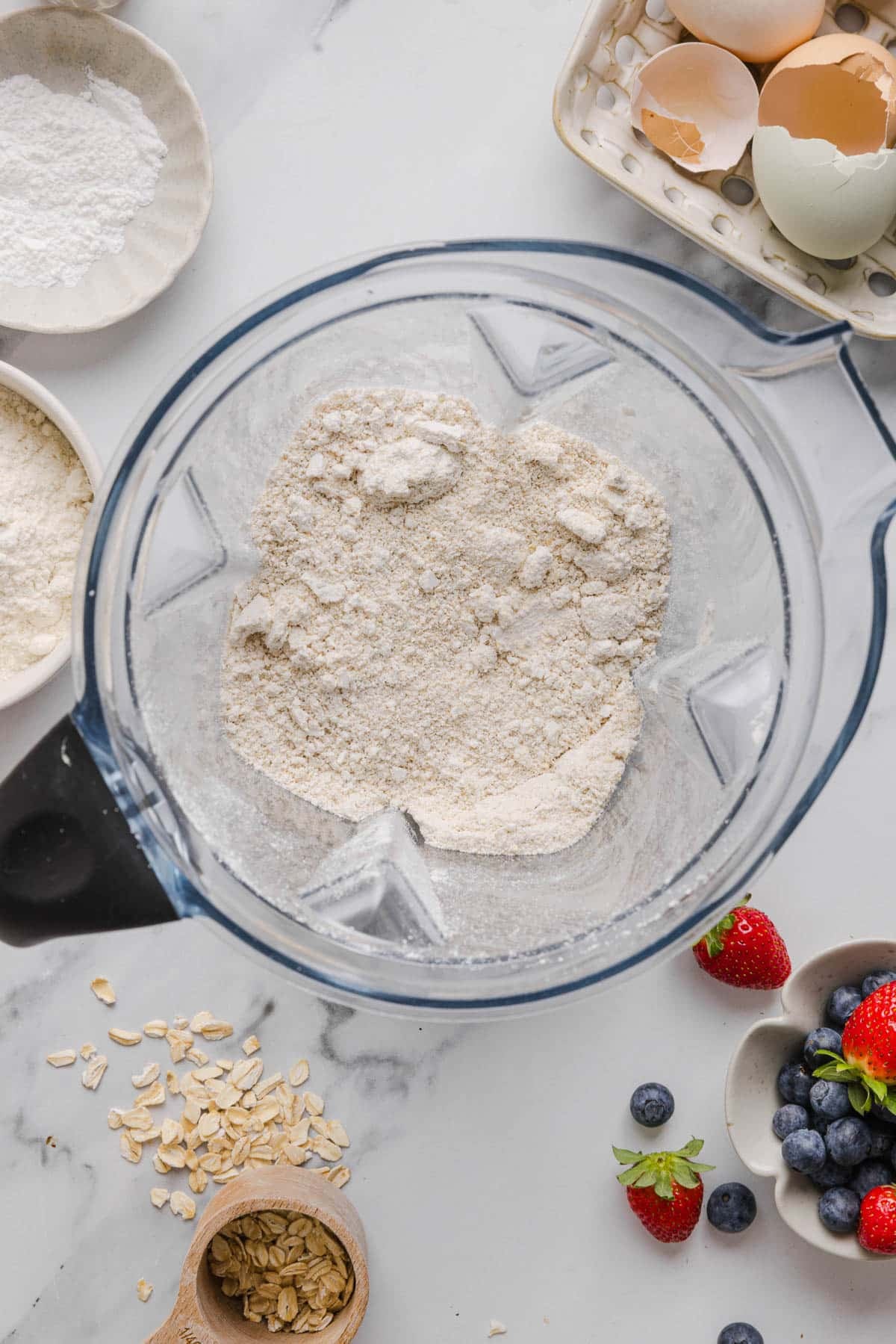 The oat flour in the blender after blending the oats.
