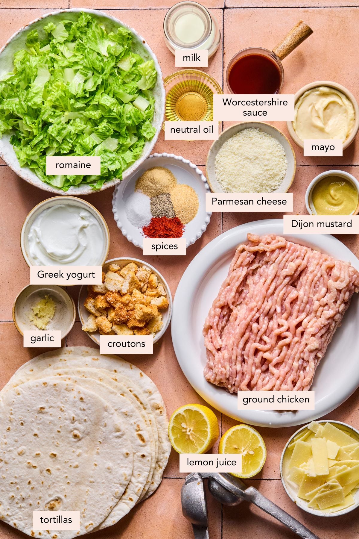 All of the ingredients for chicken caesar smash tacos in bowls on a countertop.