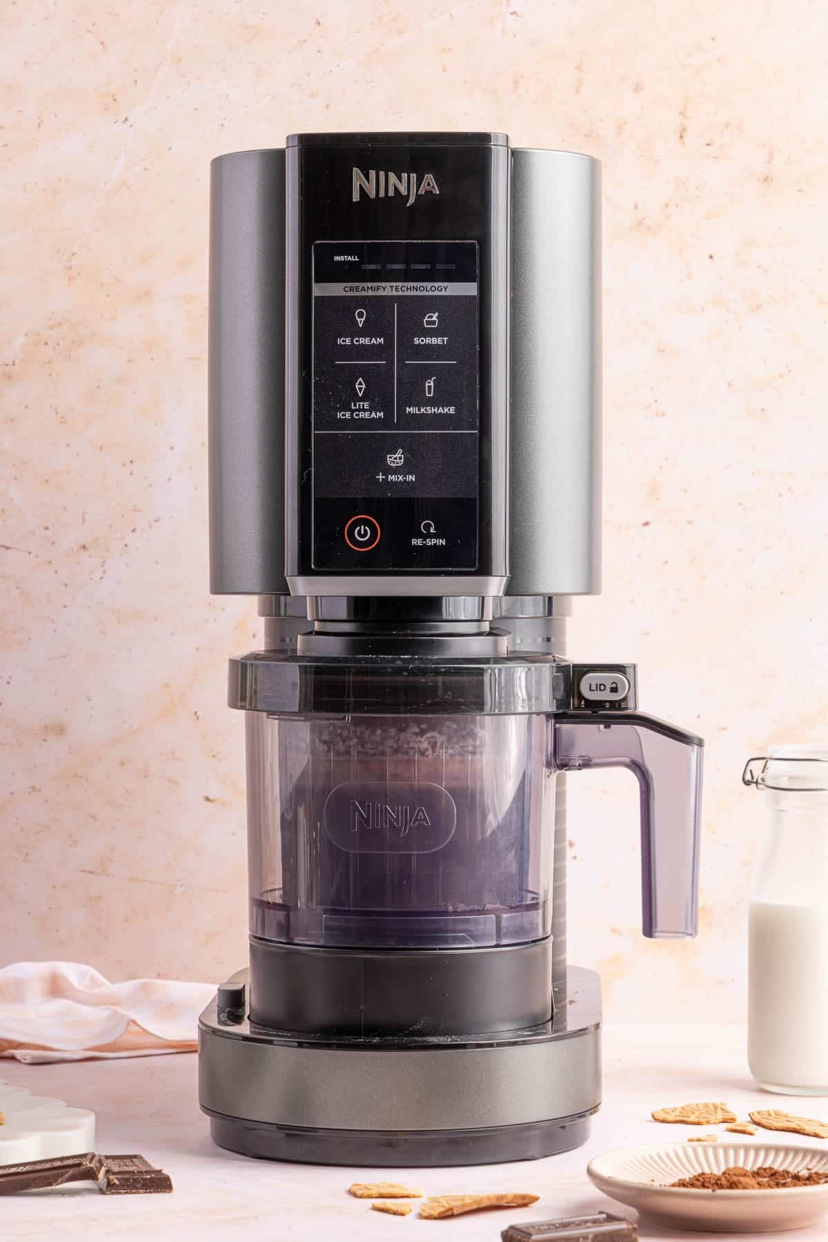 The pint container in the ninja creami machine before mixing.