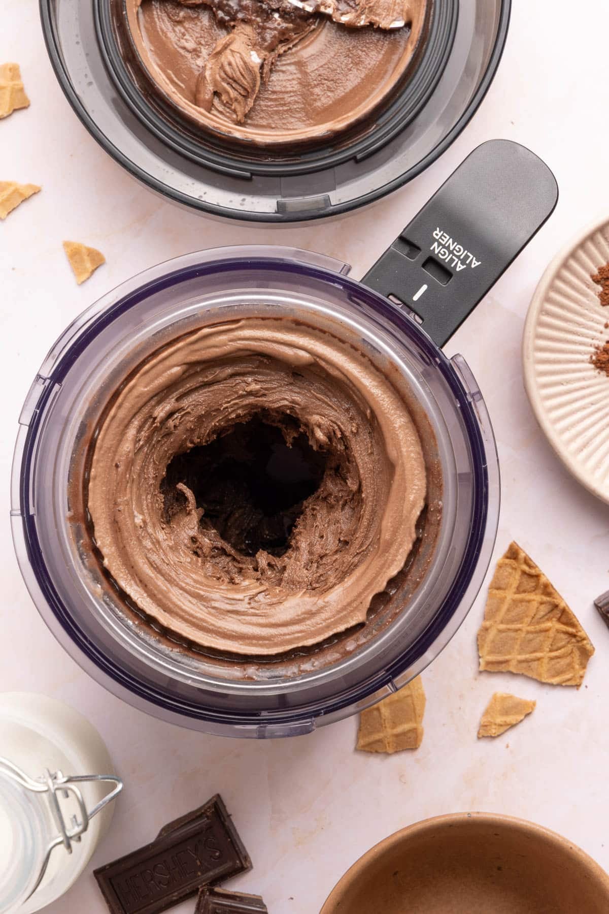 The chocolate protein ice cream in the ninja creami bowl after spinning so its smooth and creamy.