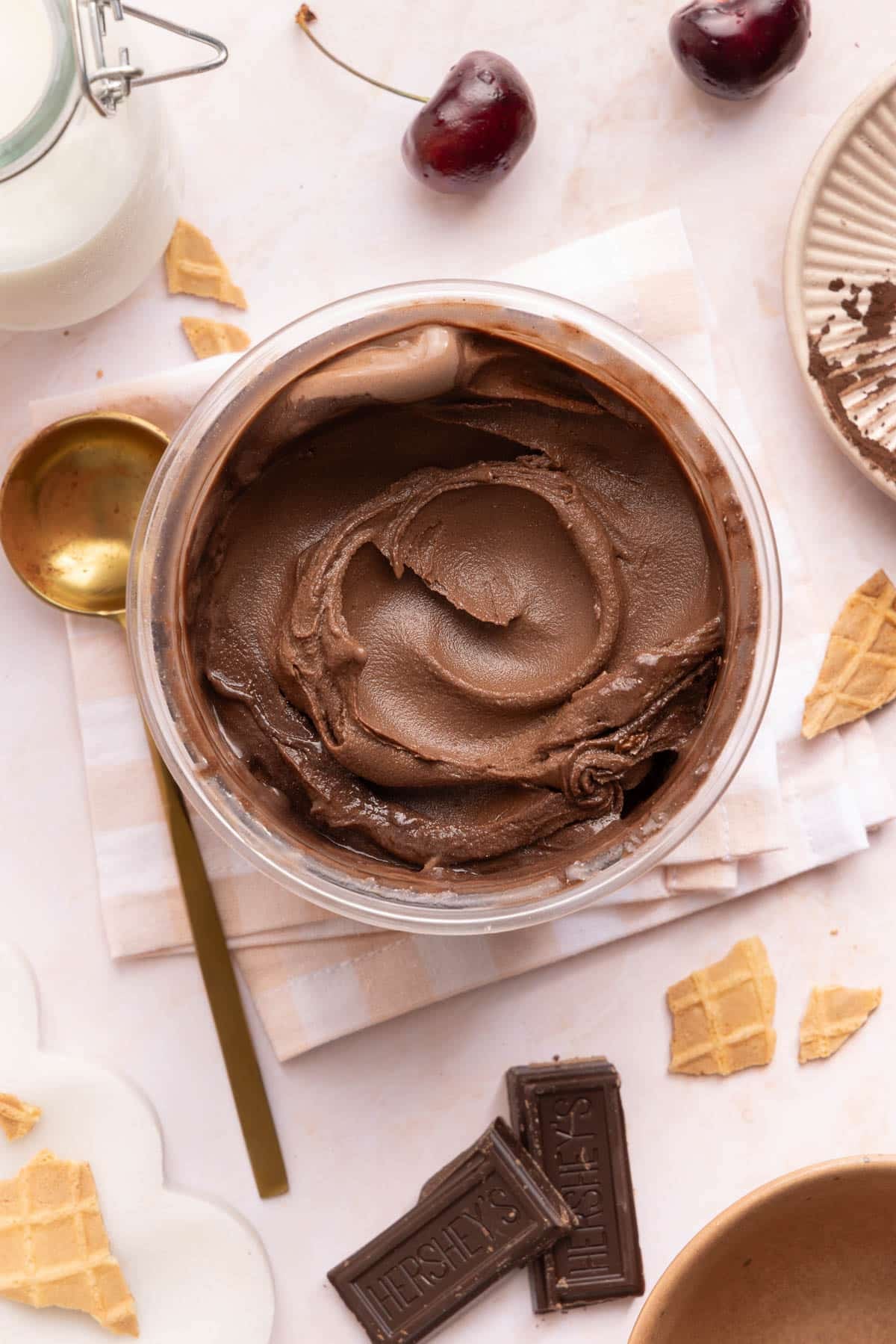 The ninja creami chocolate protein ice cream in the pint after spinning until creamy.