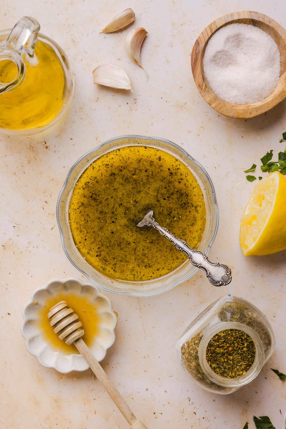 The dressing in a glass bowl on a countertop.