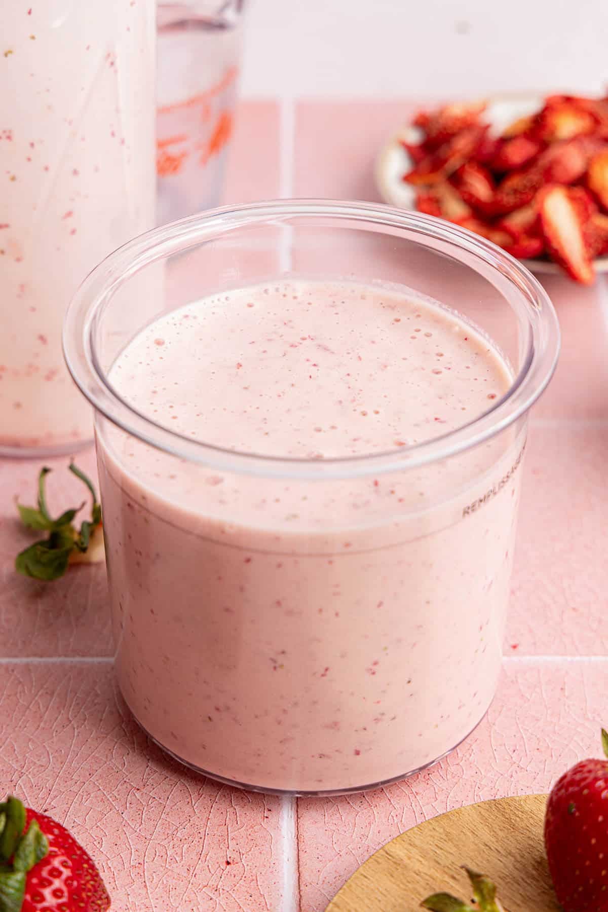 The strawberry cheesecake mixture in the ninja creami container before freezing.
