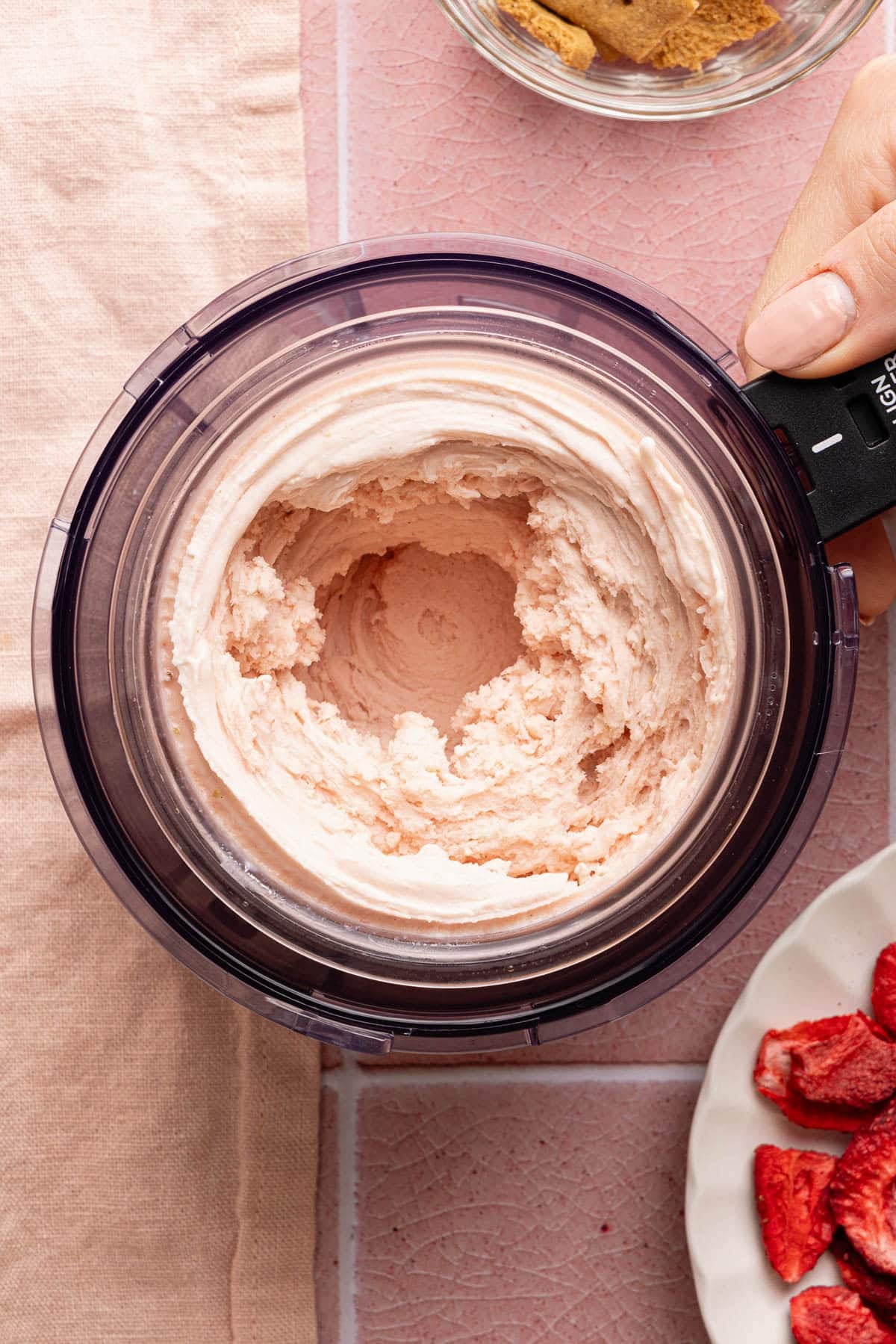 Strawberry cheesecake ice cream in the ninja creami bowl after spinning.