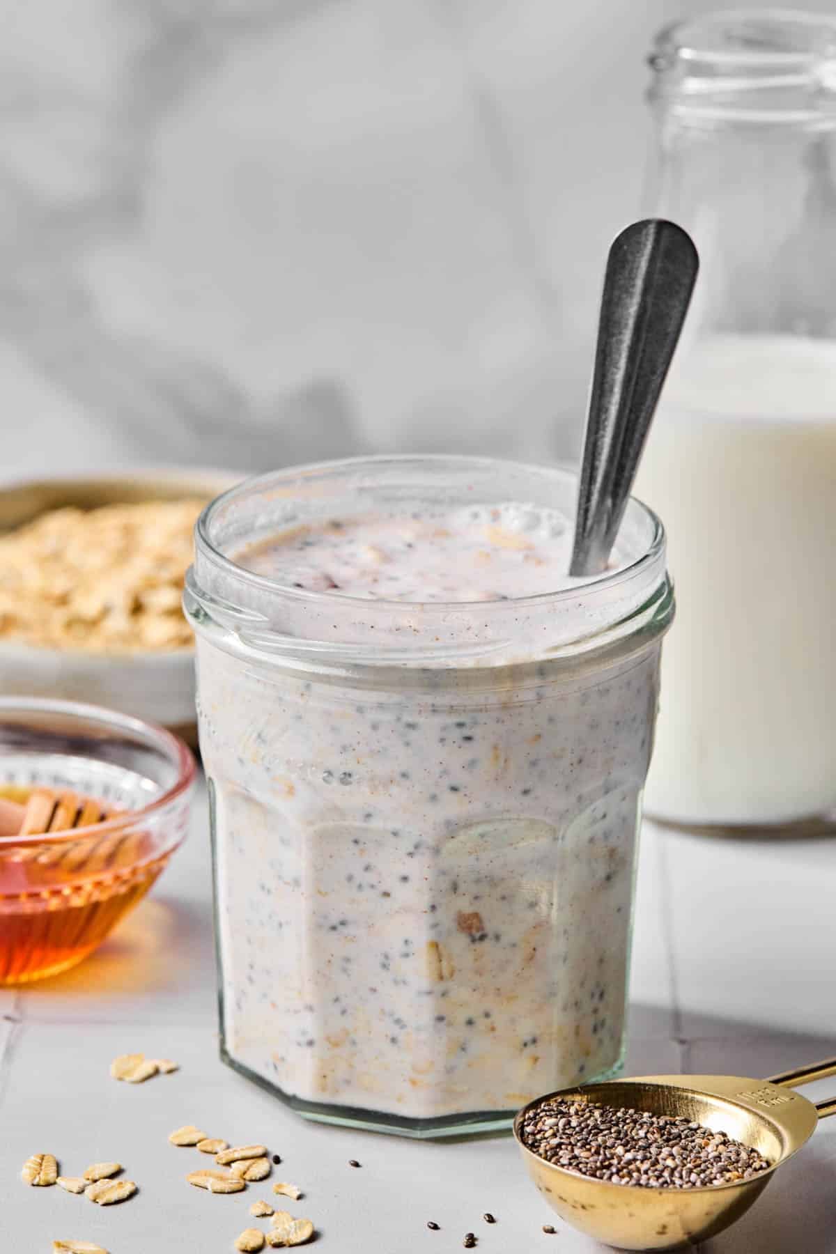 Everything stirred together in a glass jar with a spoon sitting in it.