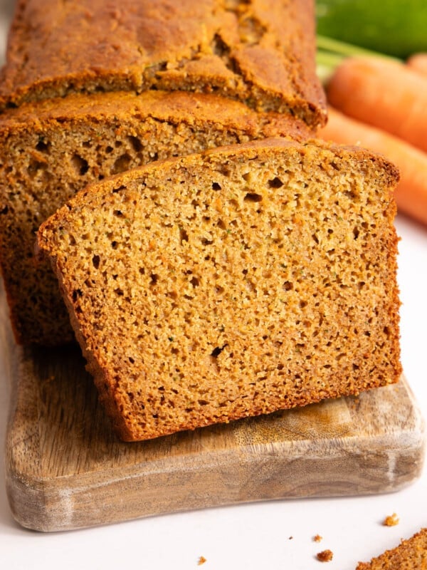 Slices of zucchini carrot bread on a cutting board.