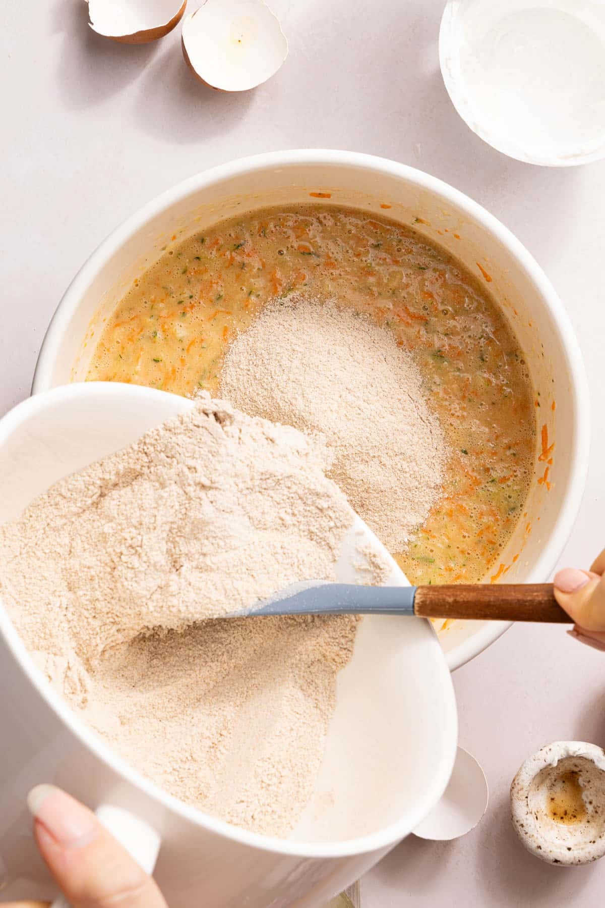 The dry ingredients in the bowl with the wet ingredients.