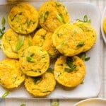 Zucchini Egg Muffins with cottage cheese on a white serving platter on a countertop.