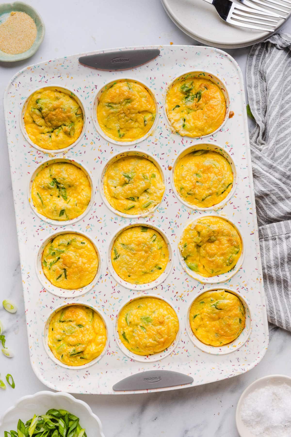 The zucchini egg muffins in the muffin pan after baking.