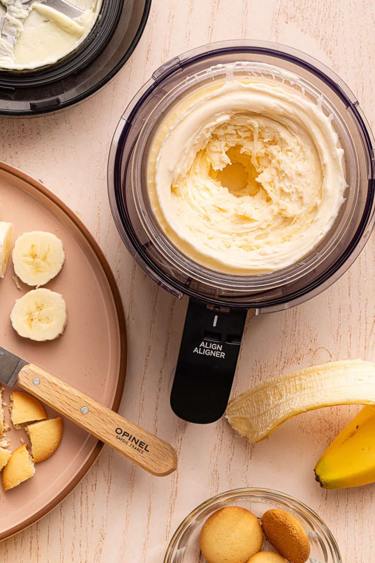 The banana pudding ice cream in the ninja creami container after mixing and freezing.