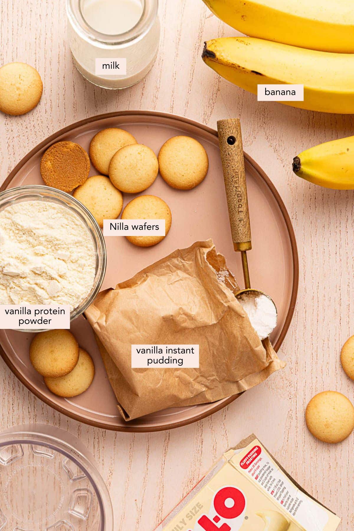 All of the ingredients for Ninja Creami Banana Pudding Ice Cream on a countertop.