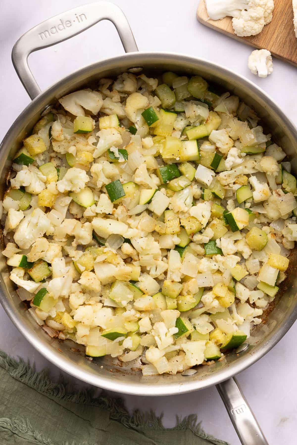 The cooked veggies in the skillet.