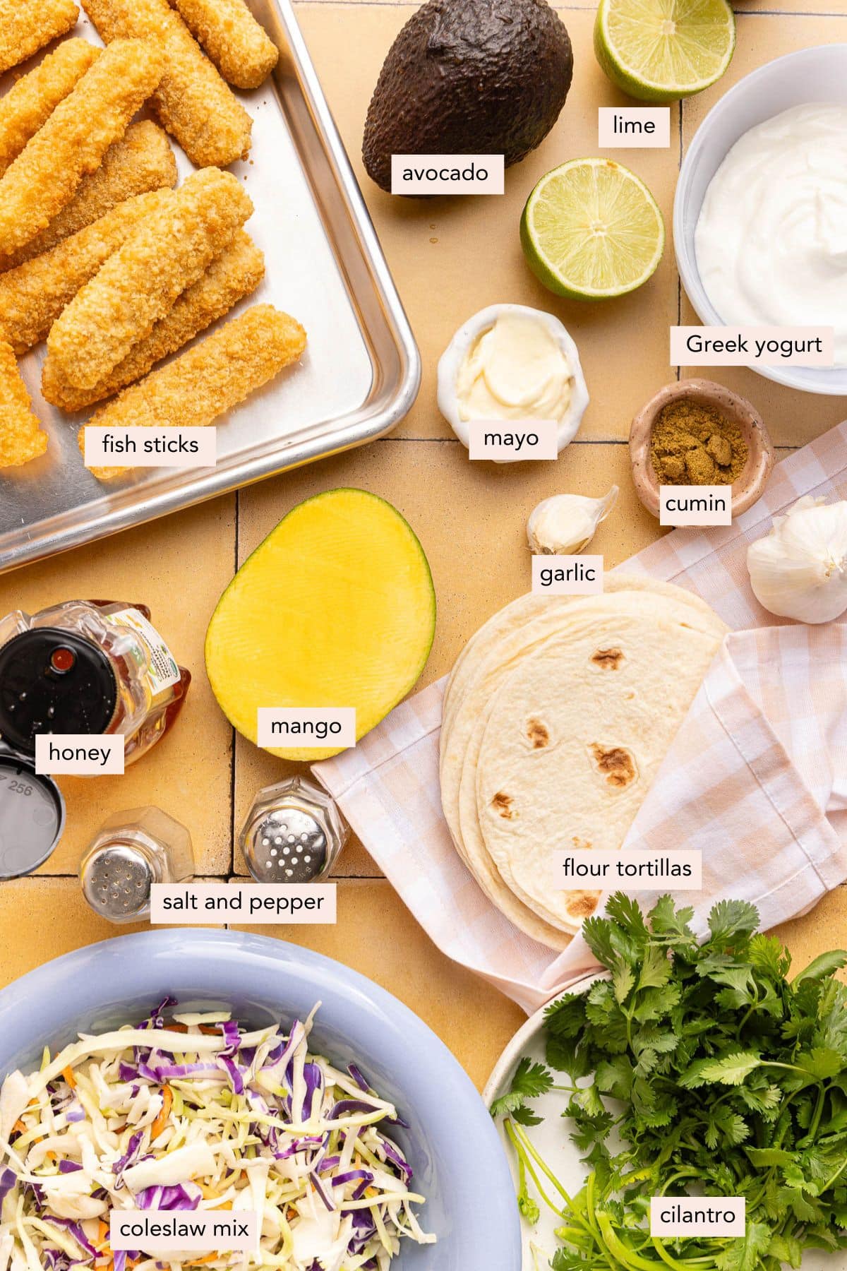 All of the ingredients for fish stick tacos on the countertop.