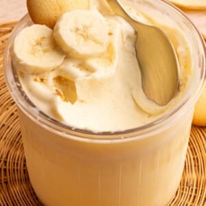 A spoon rests in a container of high-protein banana pudding ice cream made in the Ninja Creami.