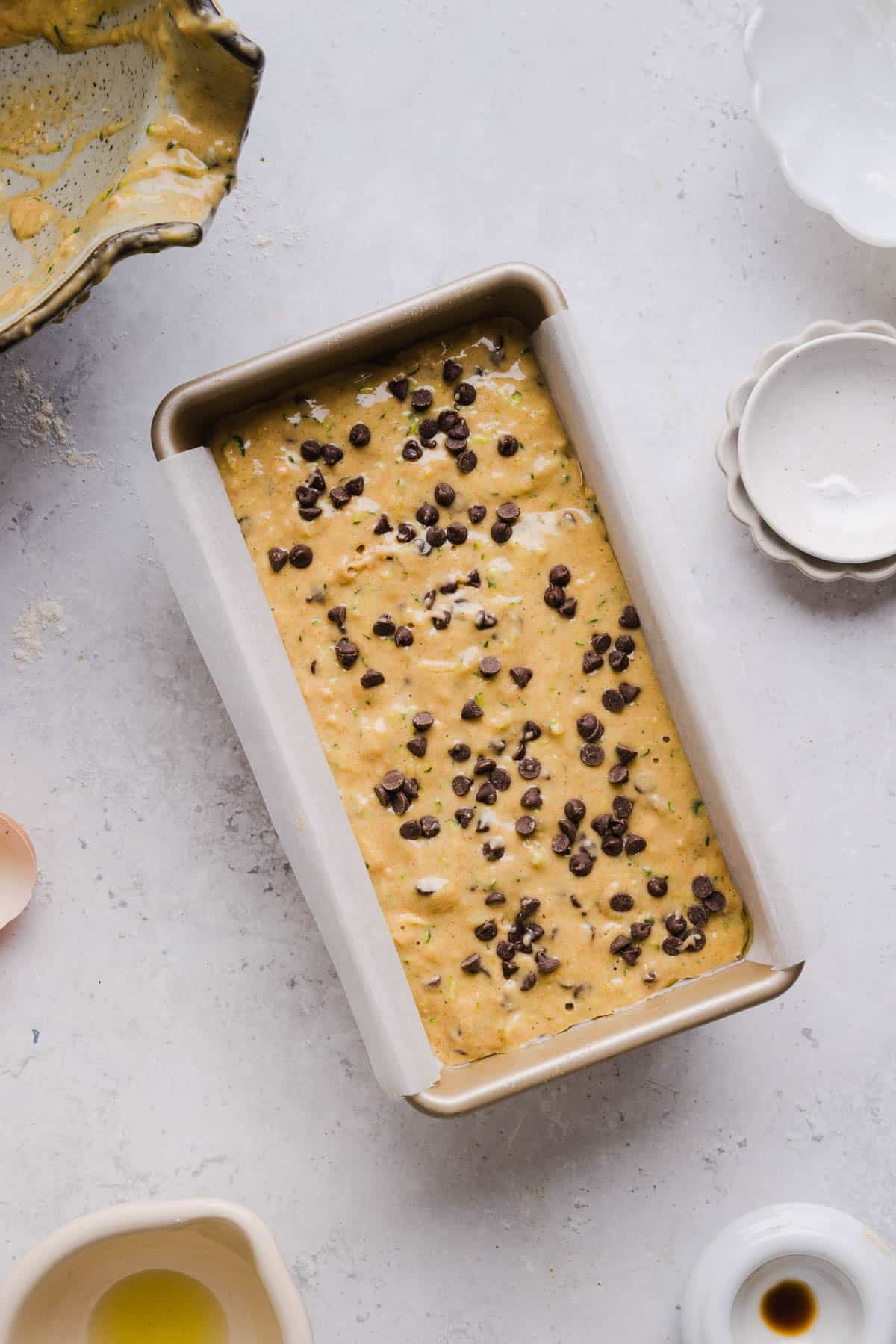 The protein zucchini batter in a baking pan before baking.